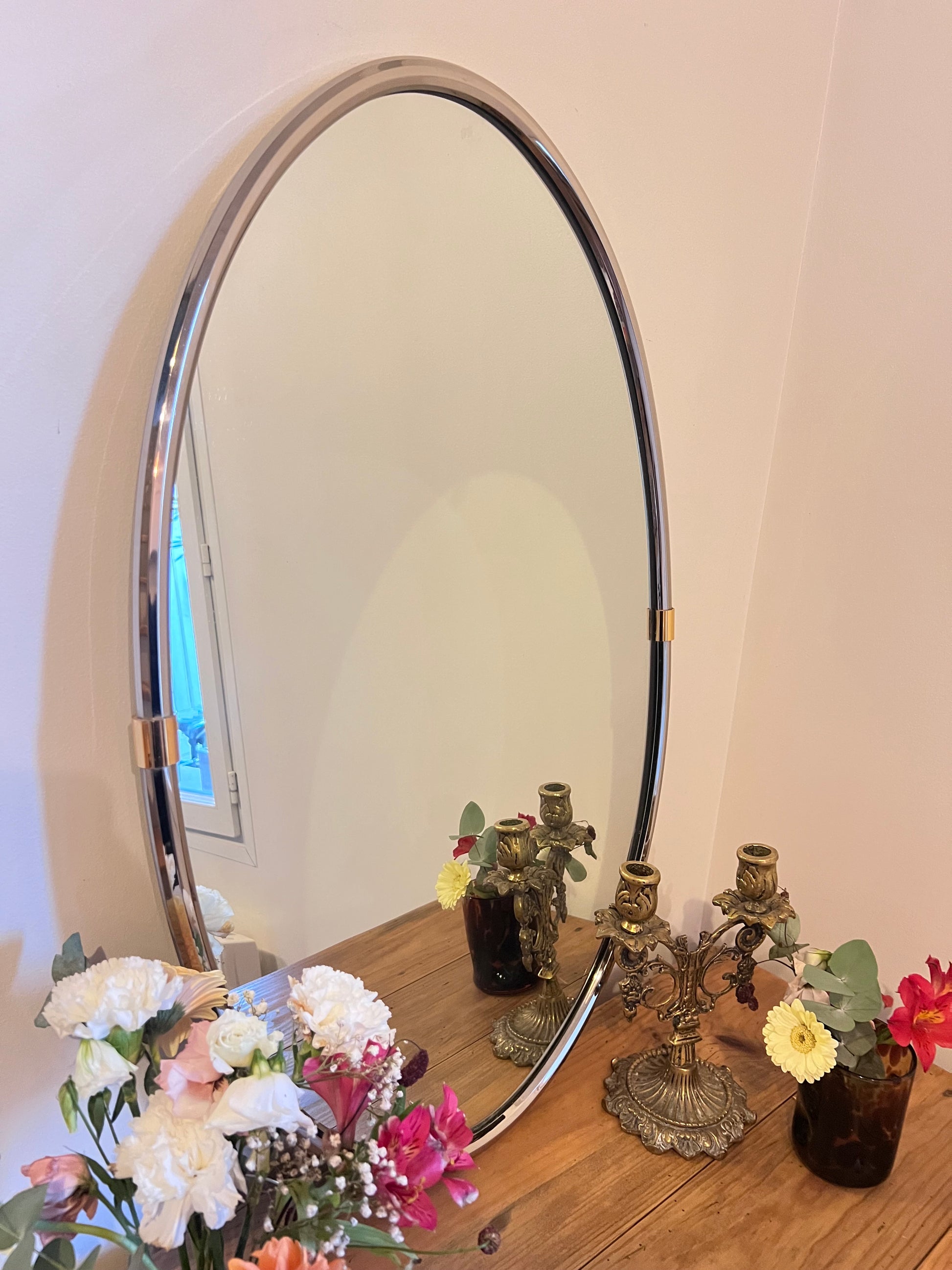 Miroir ovale en métal, parfait état.